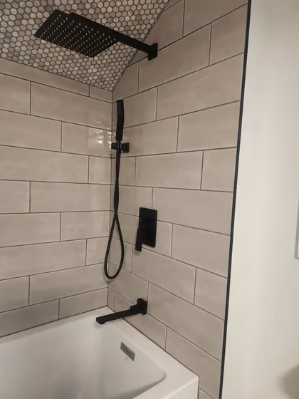 Tiled tub and shower with matte black fixtures